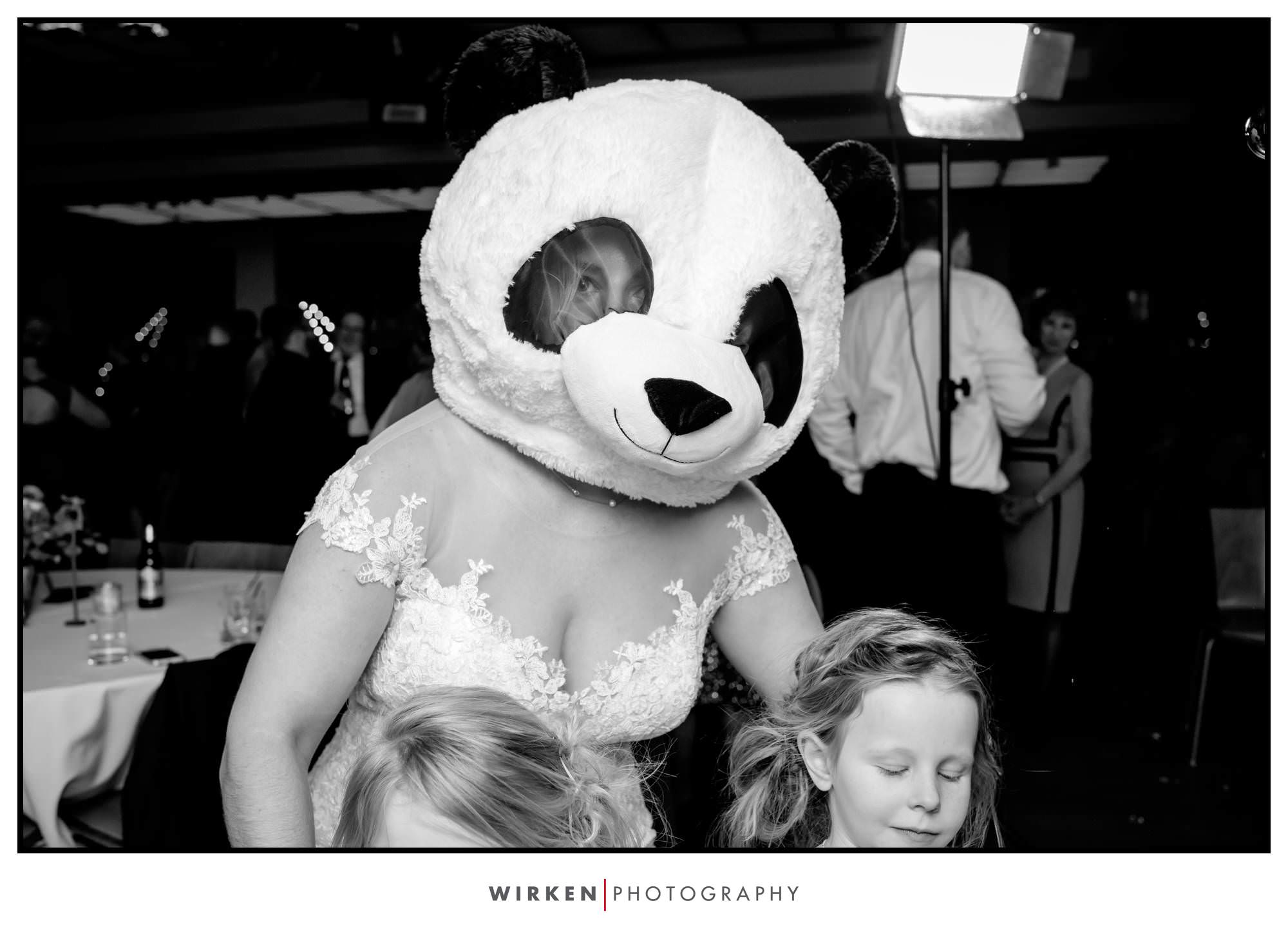 Leah wears a Panda mask at her Gallery event Center wedding reception