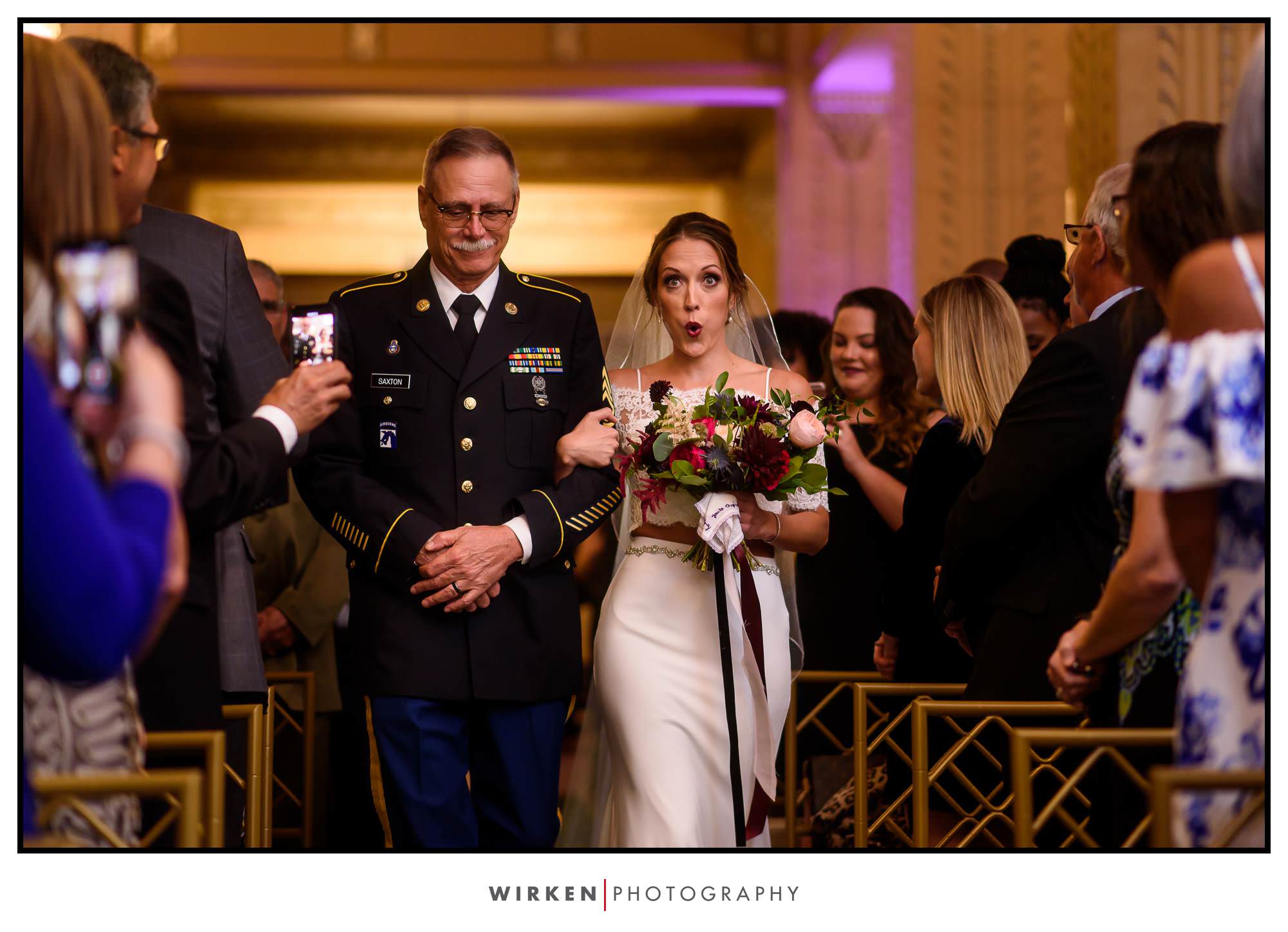 Bride and father walk down the aisle at the Grand Hall in Kansas City