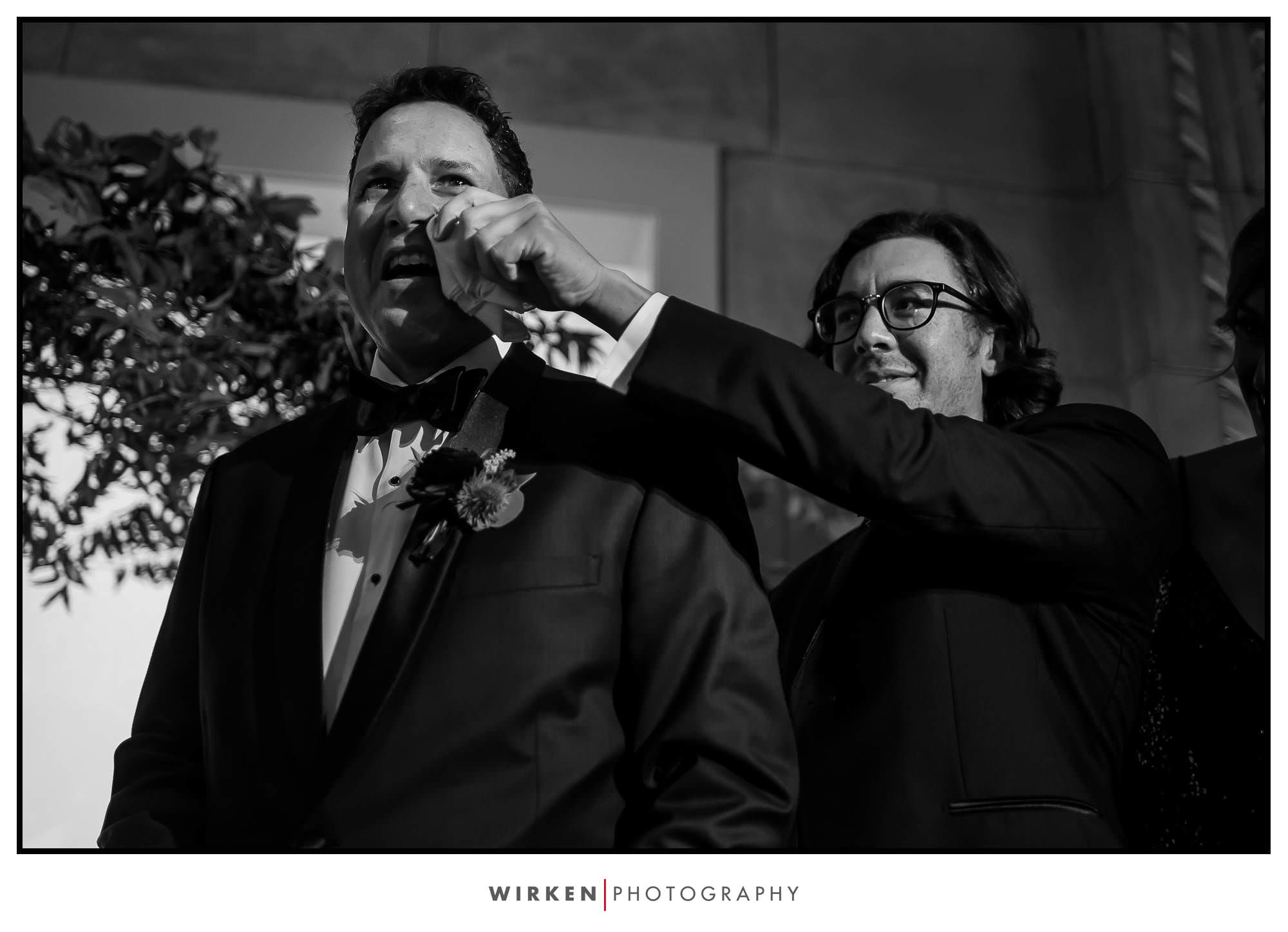 Groom tears up as his bride walks down the aisle at their Grand Hall wedding in Kansas City.