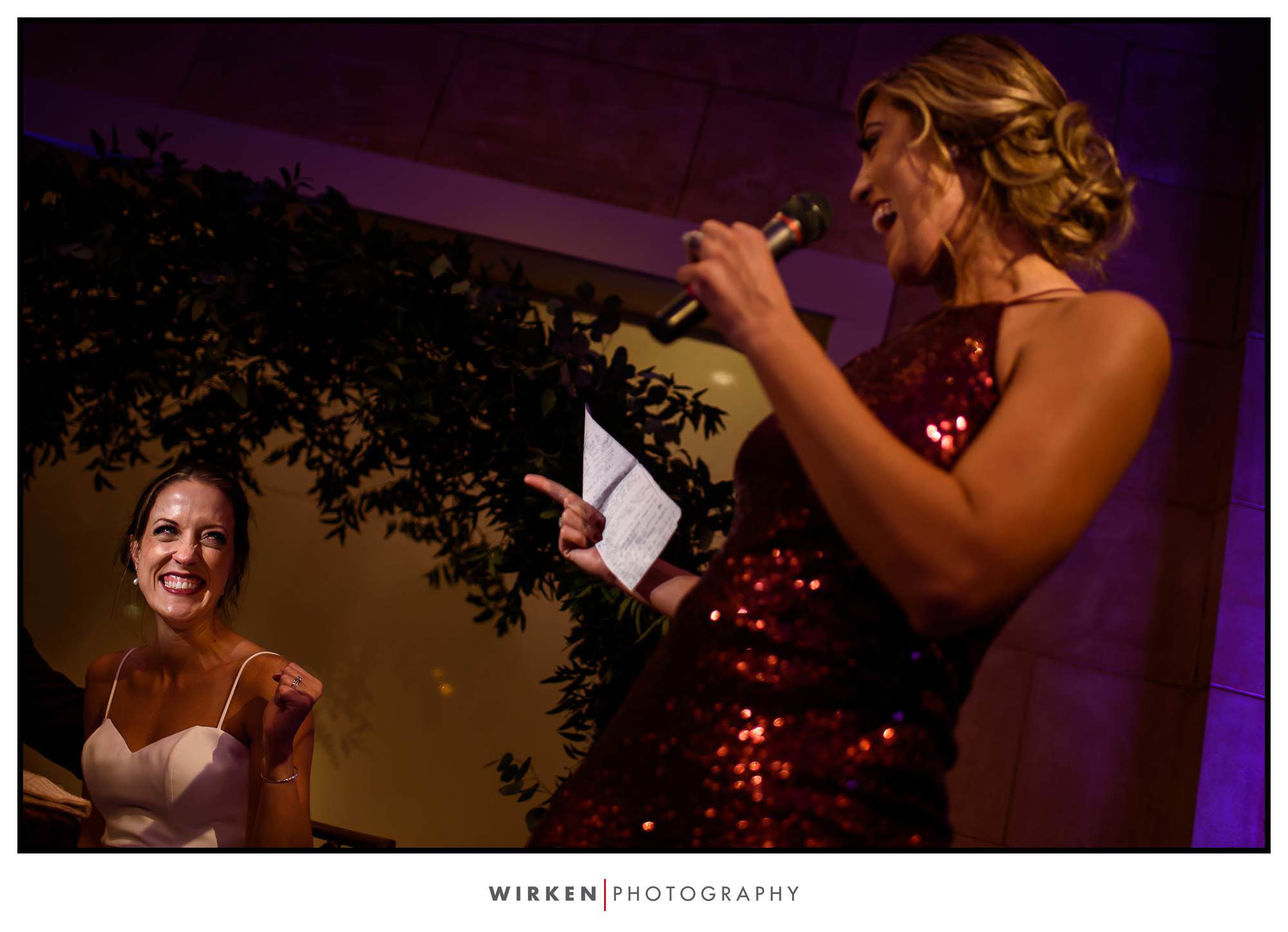 Bride reacts at toast at her Grand Hall wedding in Kansas City