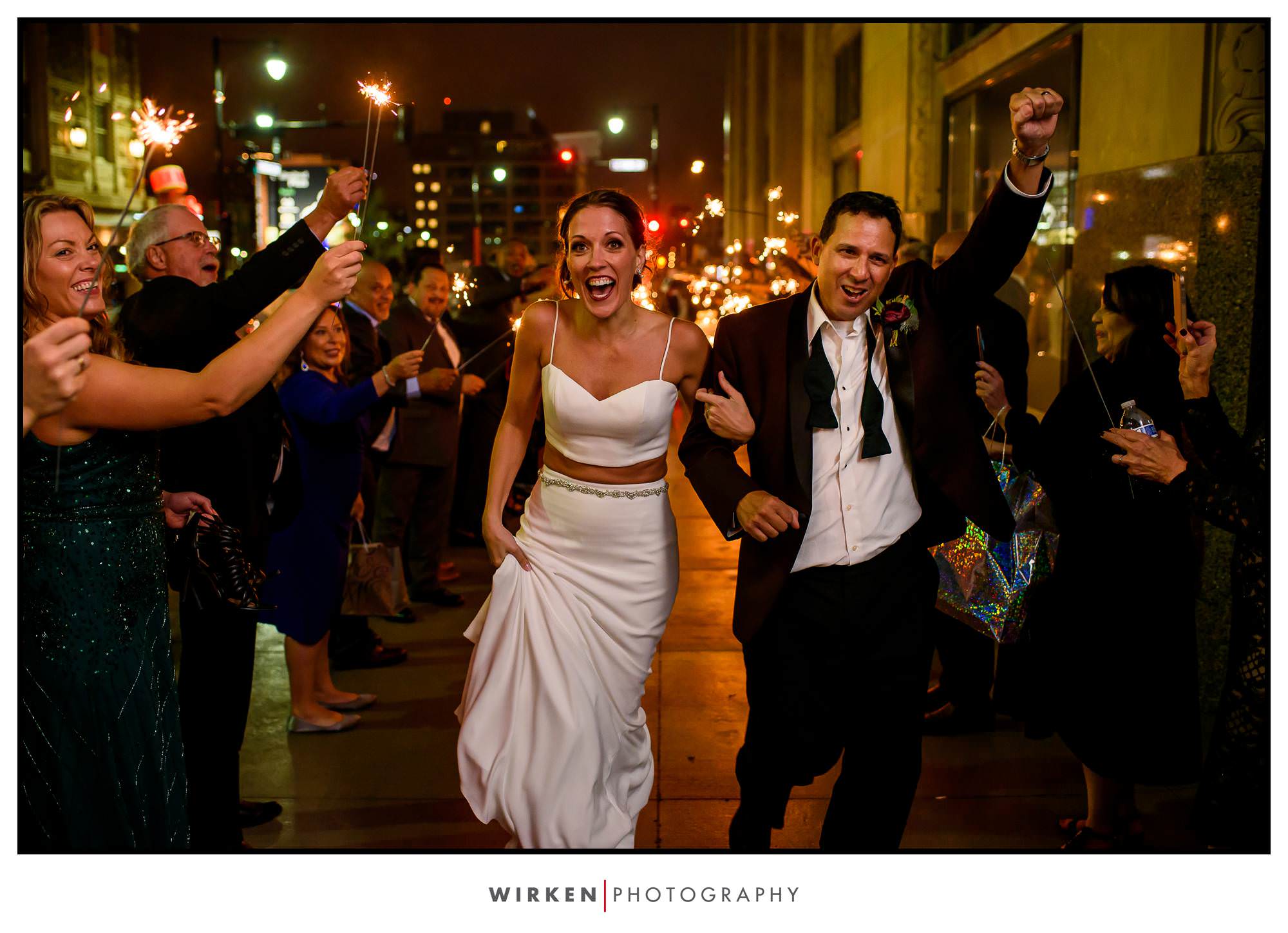 Bride and groom exit with sparklers after their Grand Hall wedding reception in Kansas City.